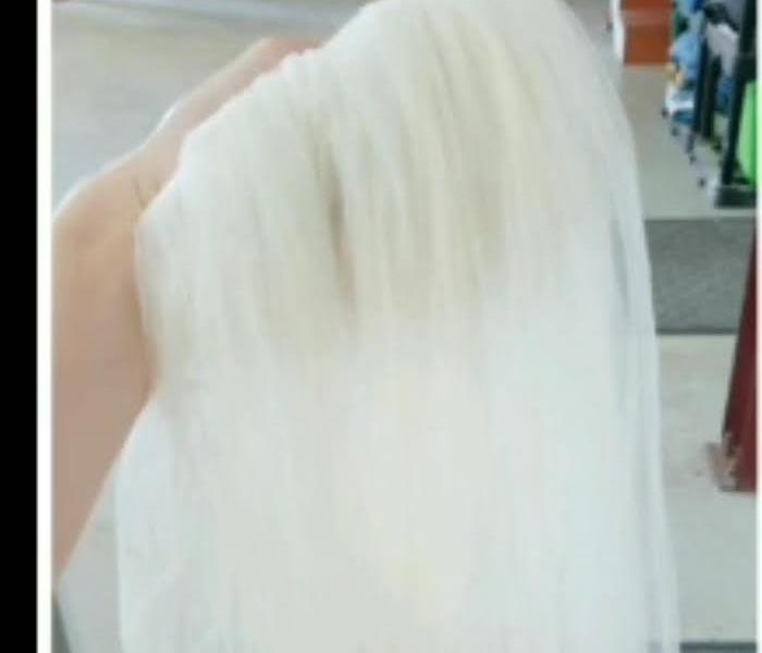 A white wedding veil after its been cleaned 