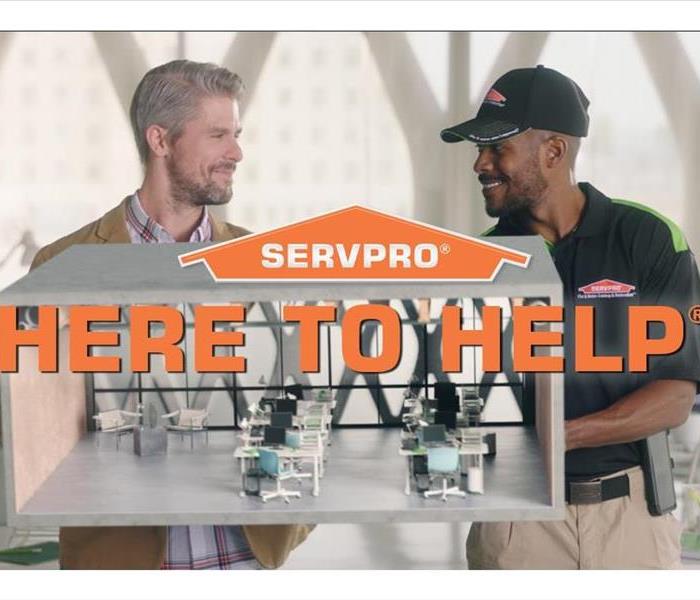 SERVPRO of East Evansville is Here to Help - image of employee and customer talking